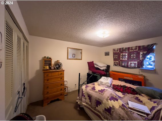 4847-4849 Elderberry Loop Springfield, OR 97478 - Photo 17 of 23 a bedroom with furniture and a bed