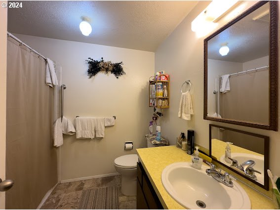 4847-4849 Elderberry Loop Springfield, OR 97478 - Photo 2 of 23 a bathroom with a sink toilet and shower