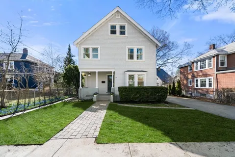 a front view of a house with a yard