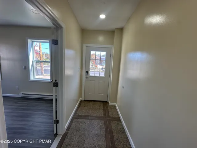 a kitchen with stainless steel appliances granite countertop a refrigerator sink and cabinets