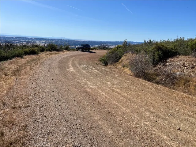 a view of a beach and sunset