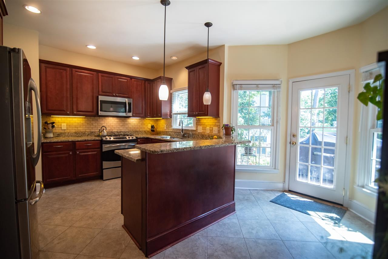 9716 Talman Court Raleigh, NC 27615 - Photo 13 of 30 Granite countertops make meal prep a breeze. Kitchen