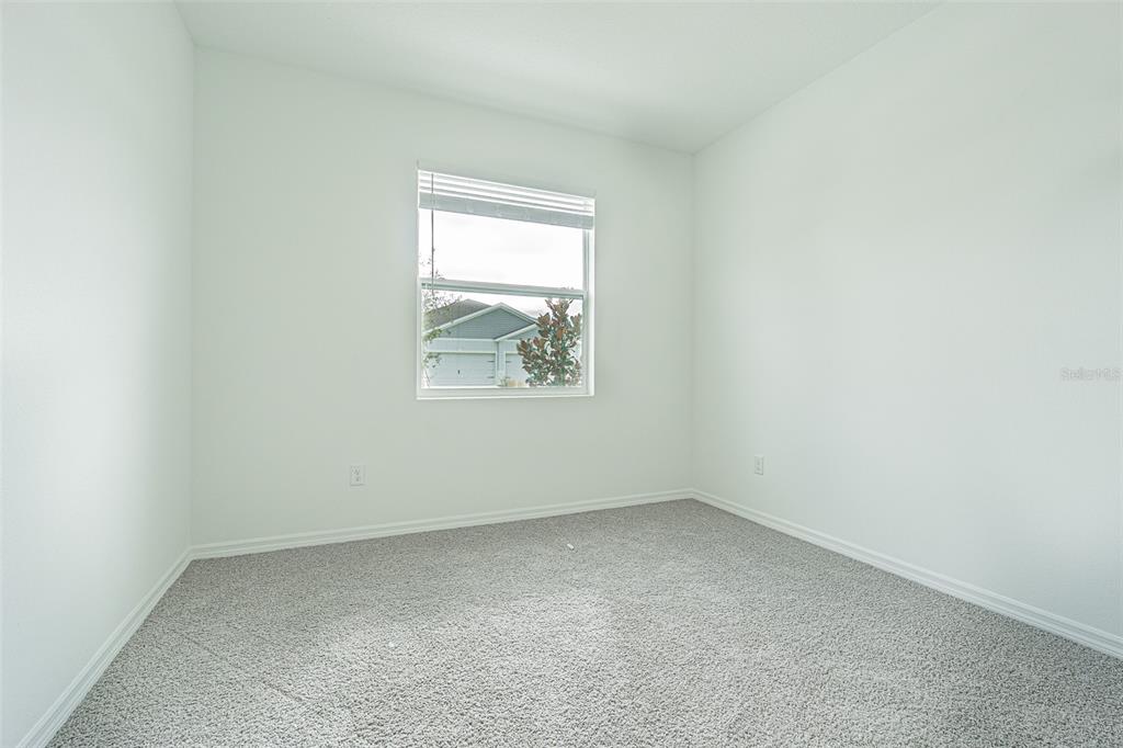31415 Paper Birch Street Wesley Chapel, FL 33545 - Photo 17 of 29 an empty room with a window