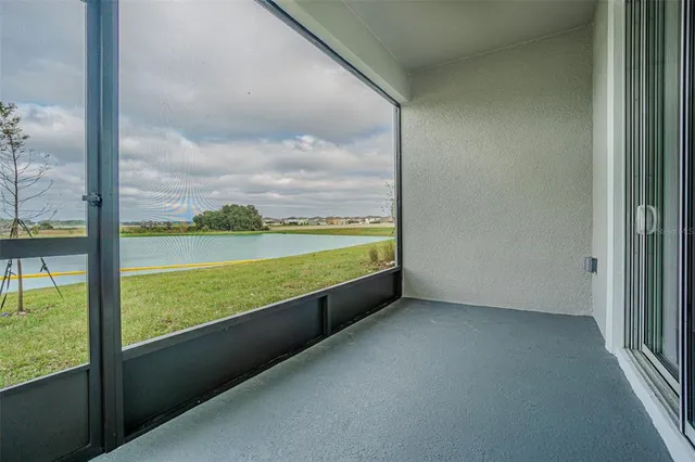an aerial view of a house with a lake view