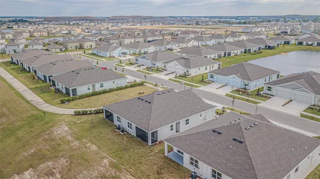 a bathroom with a granite countertop sink a toilet and a bathtub