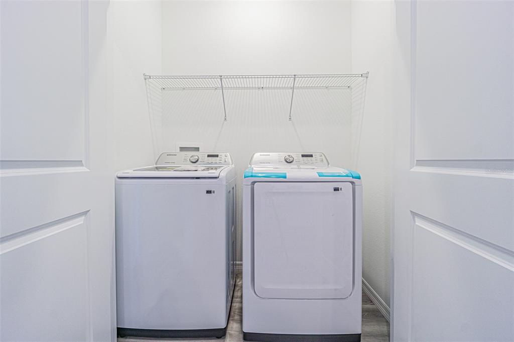 31415 Paper Birch Street Wesley Chapel, FL 33545 - Photo 26 of 29 a utility room with dryer and washer