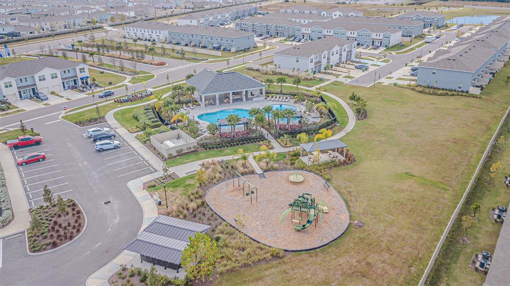 31415 Paper Birch Street Wesley Chapel, FL 33545 - Photo 4 of 29 an aerial view of a swimming pool with outdoor seating