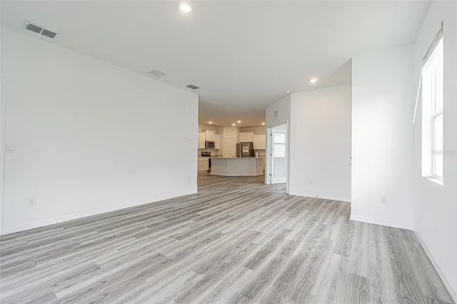 a view of a livingroom with wooden floor