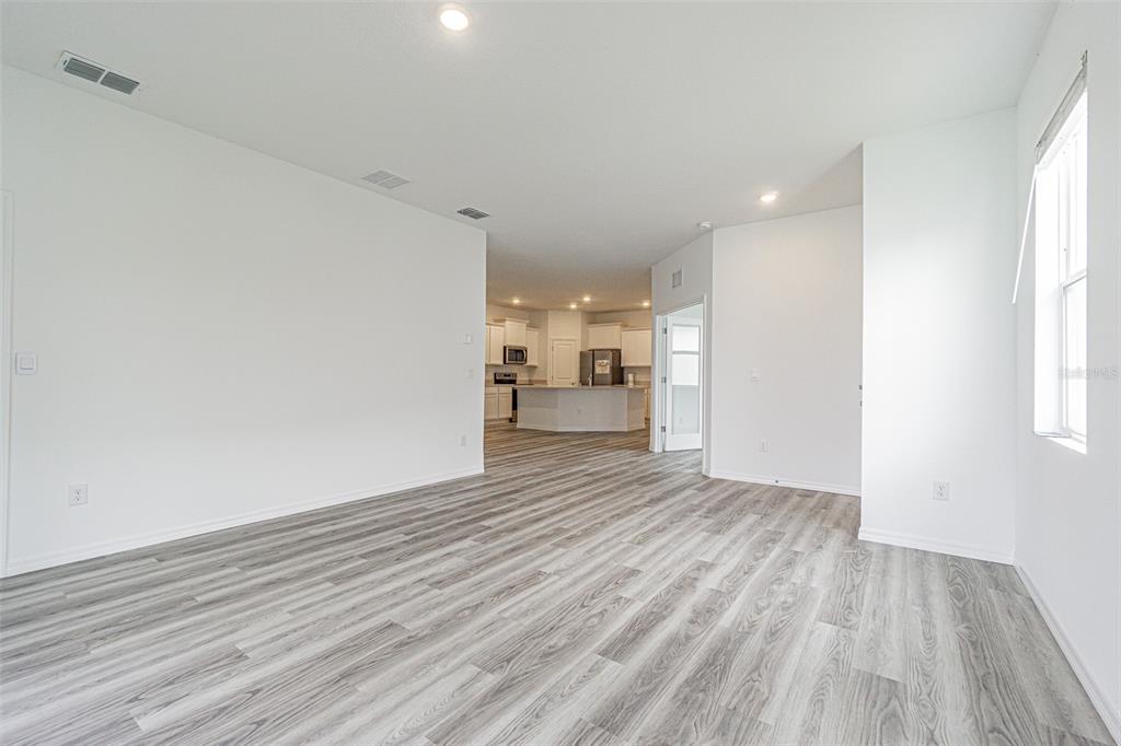 31415 Paper Birch Street Wesley Chapel, FL 33545 - Photo 7 of 29 a view of a livingroom with wooden floor