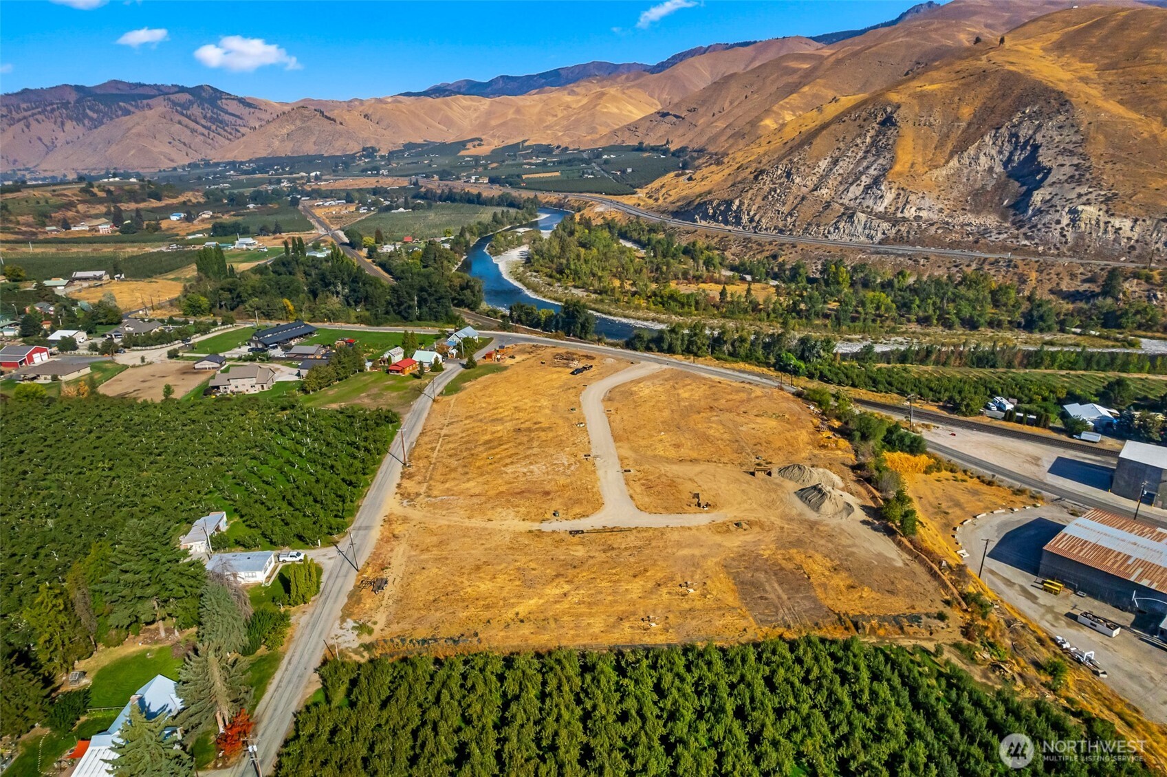85 Farmer Lane Monitor, WA 98836 - Photo 3 of 13 a view of a swimming pool with a lake view