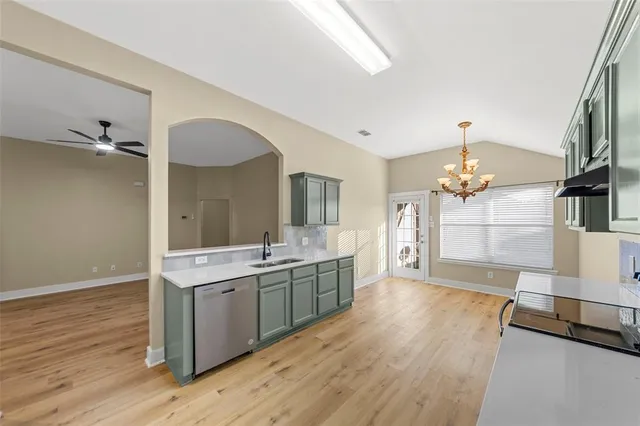 a spacious bathroom with a double vanity sink and a mirror