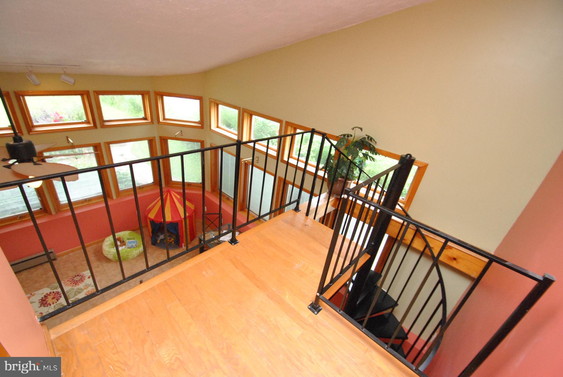 9620 Dundawan Road Baltimore, MD 21236 - Photo 17 of 30 VIEW FROM UPPER LEVEL GREAT ROOM - SPIRAL STAIRS