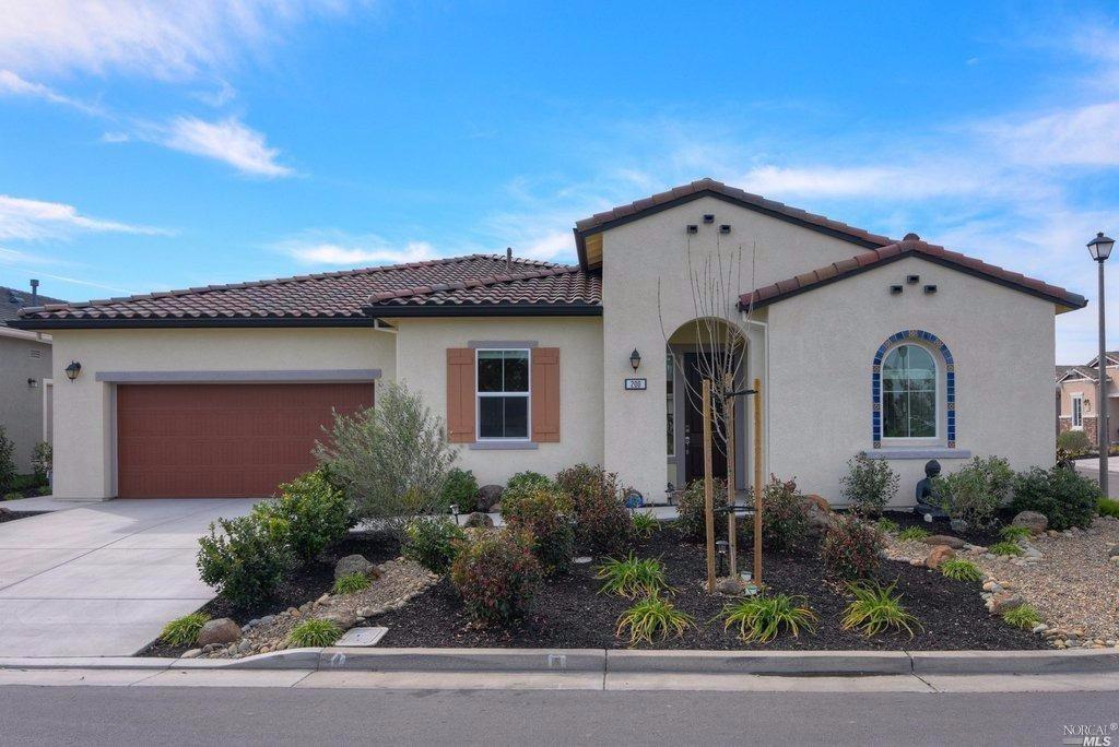 a front view of a house with garage