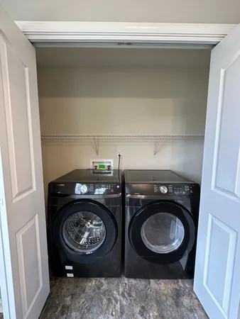 a view of washer and dryer in a utility room
