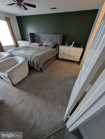 a bedroom with bed and window