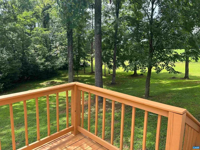 a front view of house with yard and trees