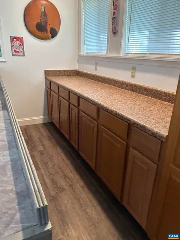 a living room with furniture and a mirror