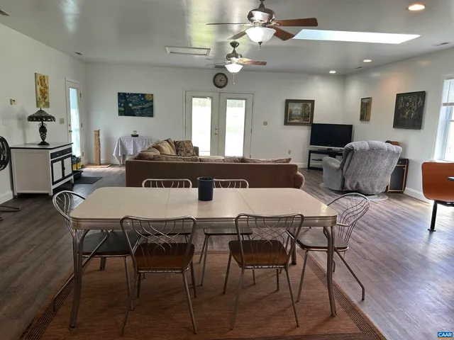 a workspace with furniture and wooden floor