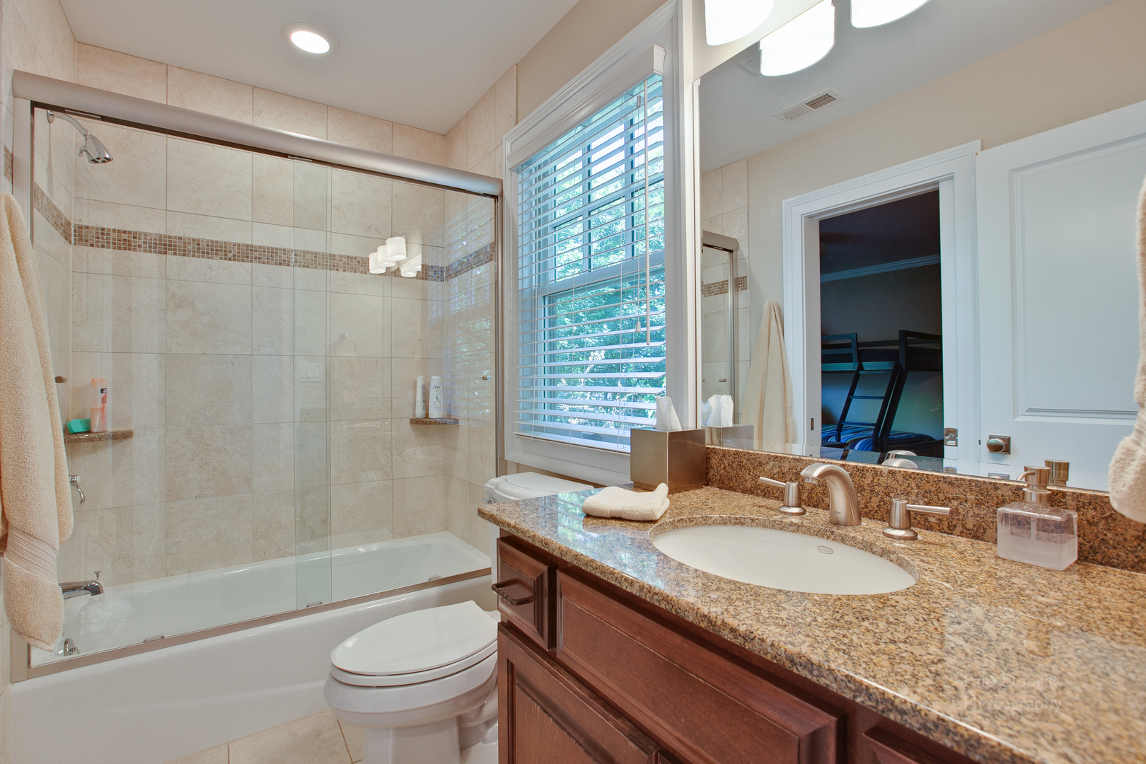 231 Franklin Road Glencoe, IL 60022 - Photo 23 of 49 a bathroom with a granite countertop sink a toilet and shower
