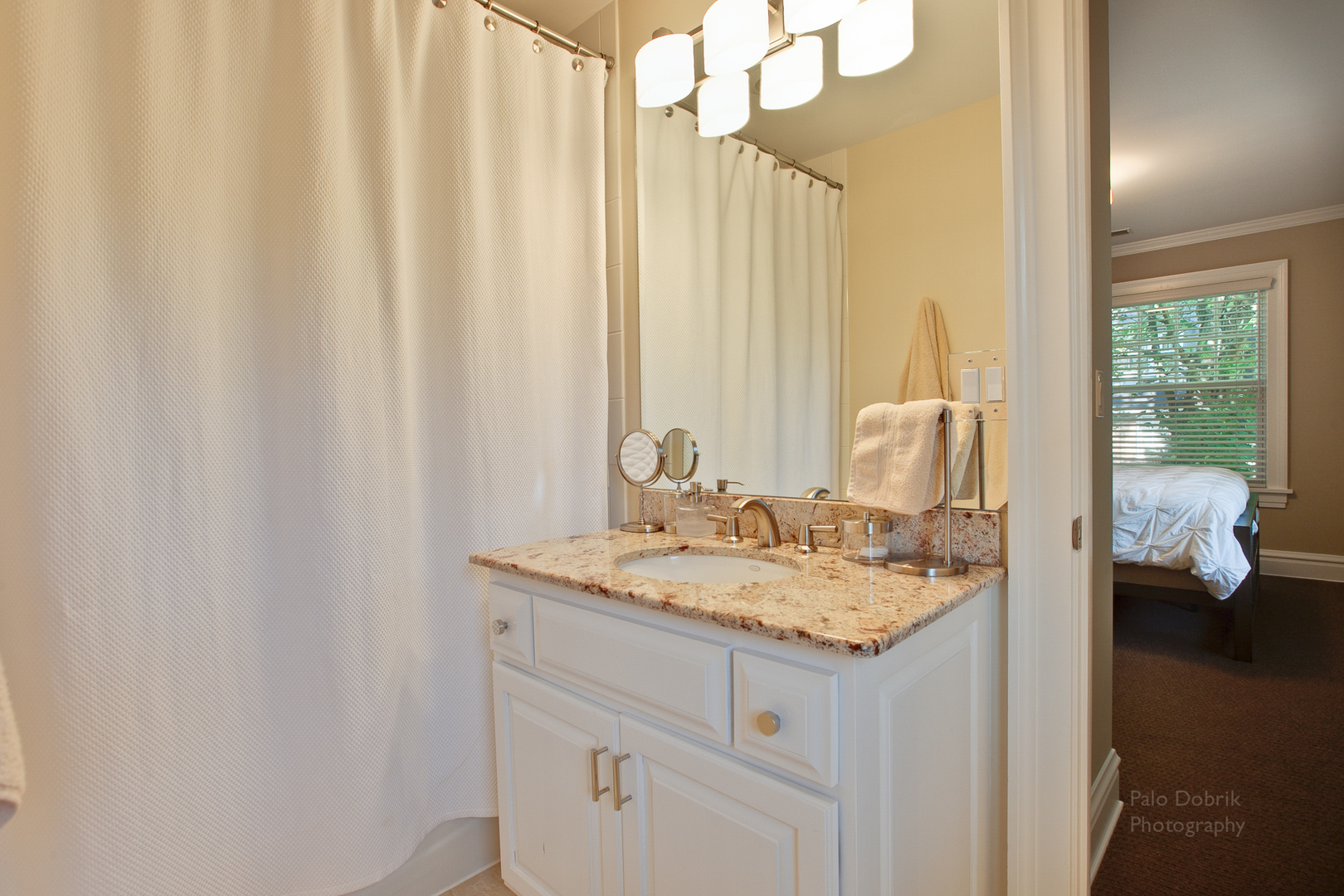231 Franklin Road Glencoe, IL 60022 - Photo 26 of 49 a bathroom with a granite countertop sink and a mirror