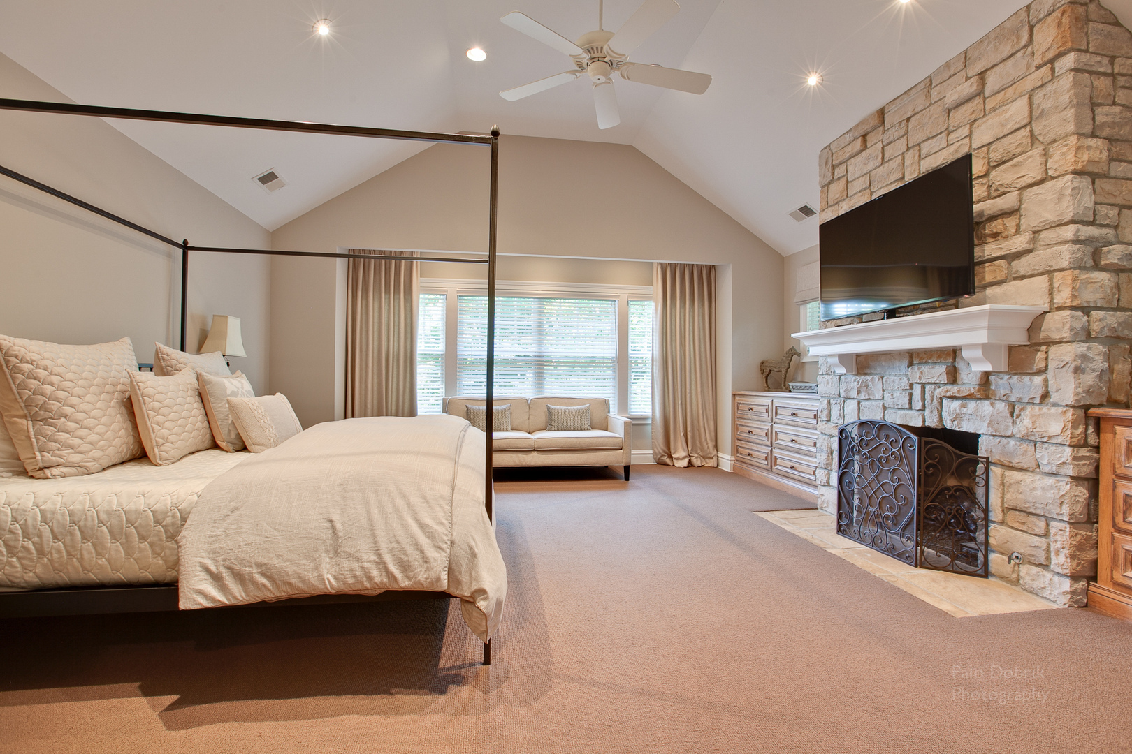 231 Franklin Road Glencoe, IL 60022 - Photo 31 of 49 a spacious bedroom with a bed and a fireplace