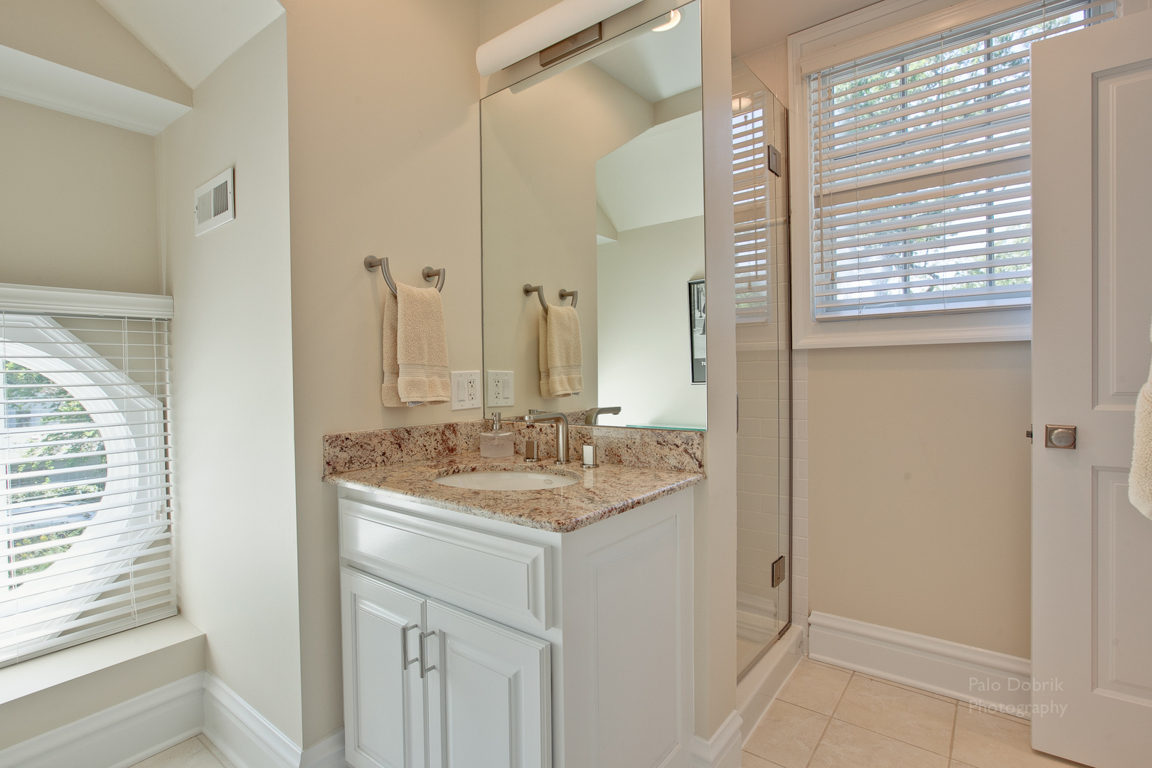 231 Franklin Road Glencoe, IL 60022 - Photo 38 of 49 a bathroom with a granite countertop sink and a mirror