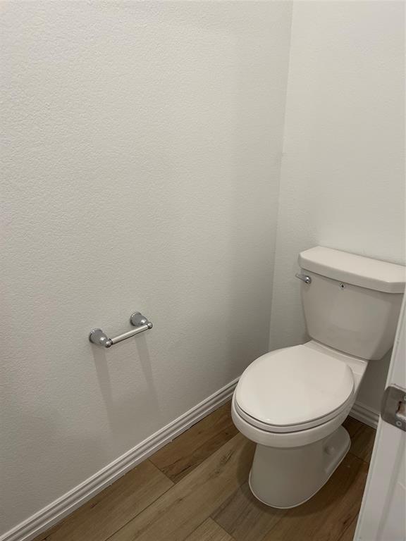 1204 Sequoia Lane Princeton, TX 75407 - Photo 15 of 20 a white toilet sitting next to a white wall