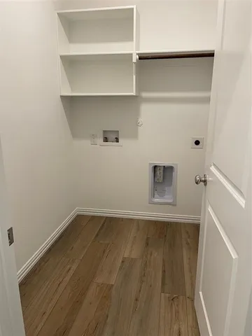 a view of a backyard with wooden fence