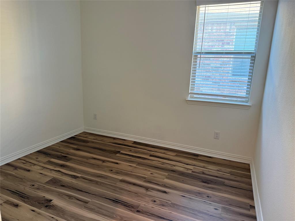 1204 Sequoia Lane Princeton, TX 75407 - Photo 3 of 20 a view of a small space with wooden floor and a window