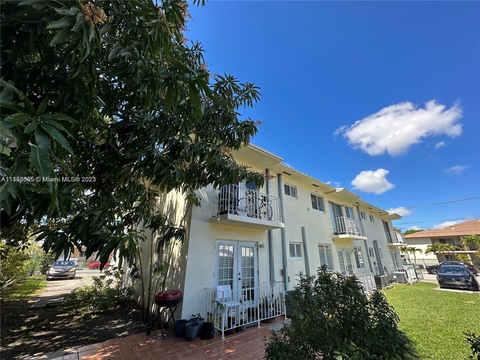 The Roads Miami, FL 33130 - Photo 1 of 2 a front view of a residential houses with yard and green space