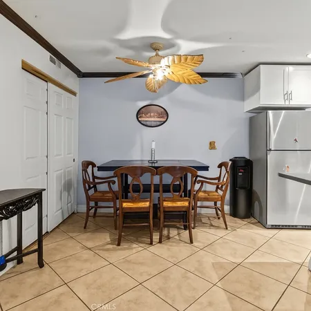 a view of dining room cabinets and chairs