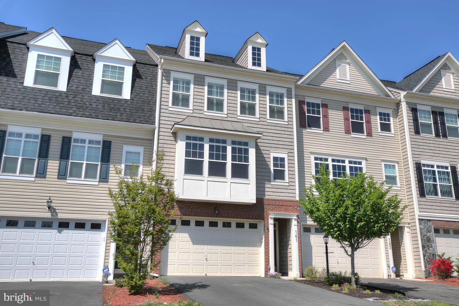 141 Short Branch Road Stafford, VA 22556 - Photo 1 of 30 a front view of a house with a yard and garage