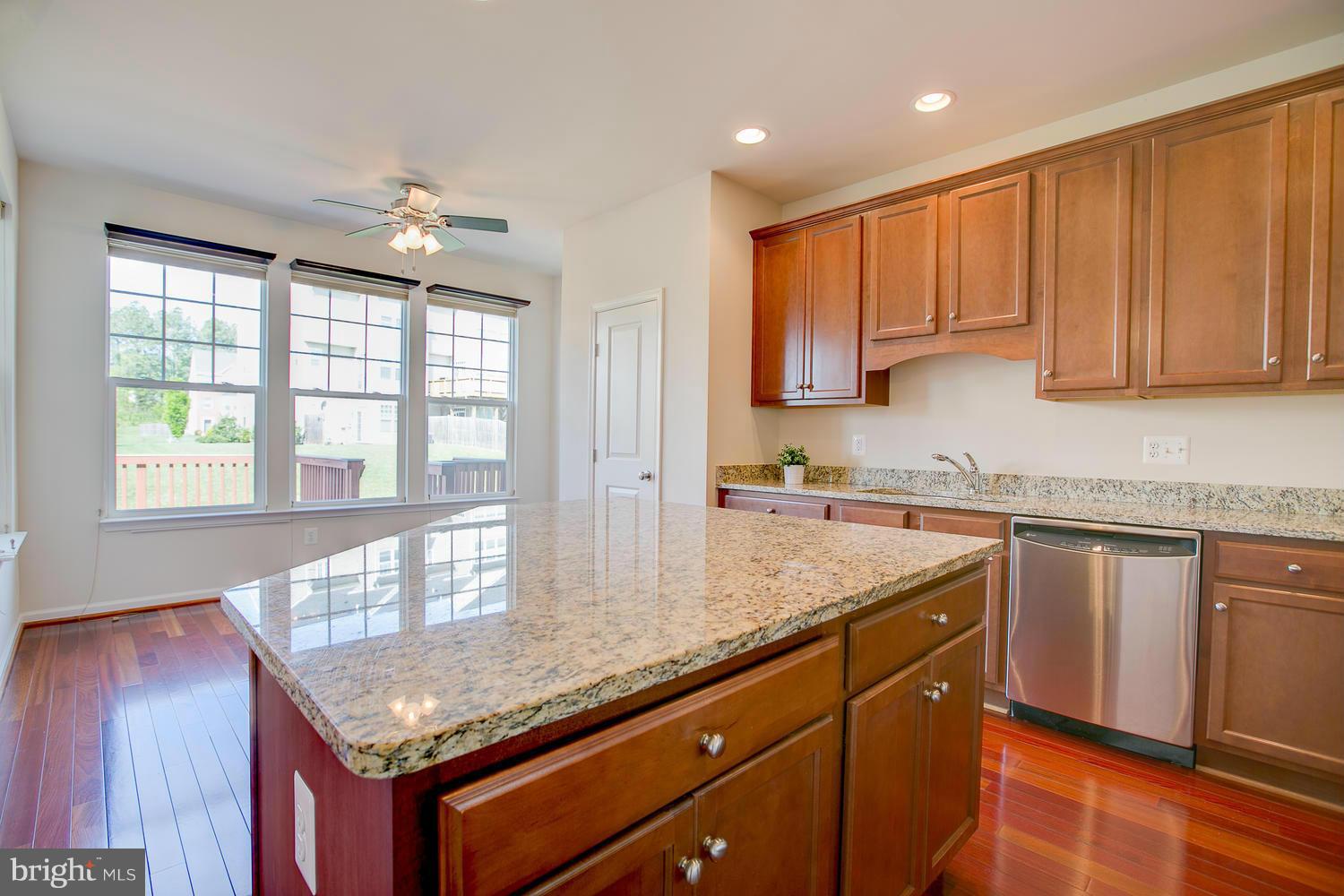141 Short Branch Road Stafford, VA 22556 - Photo 14 of 30 a kitchen with granite countertop a sink a counter space appliances and cabinets