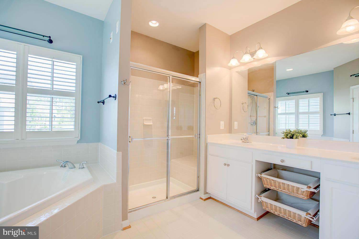 141 Short Branch Road Stafford, VA 22556 - Photo 17 of 30 a spacious bathroom with a tub shower a sink and mirror