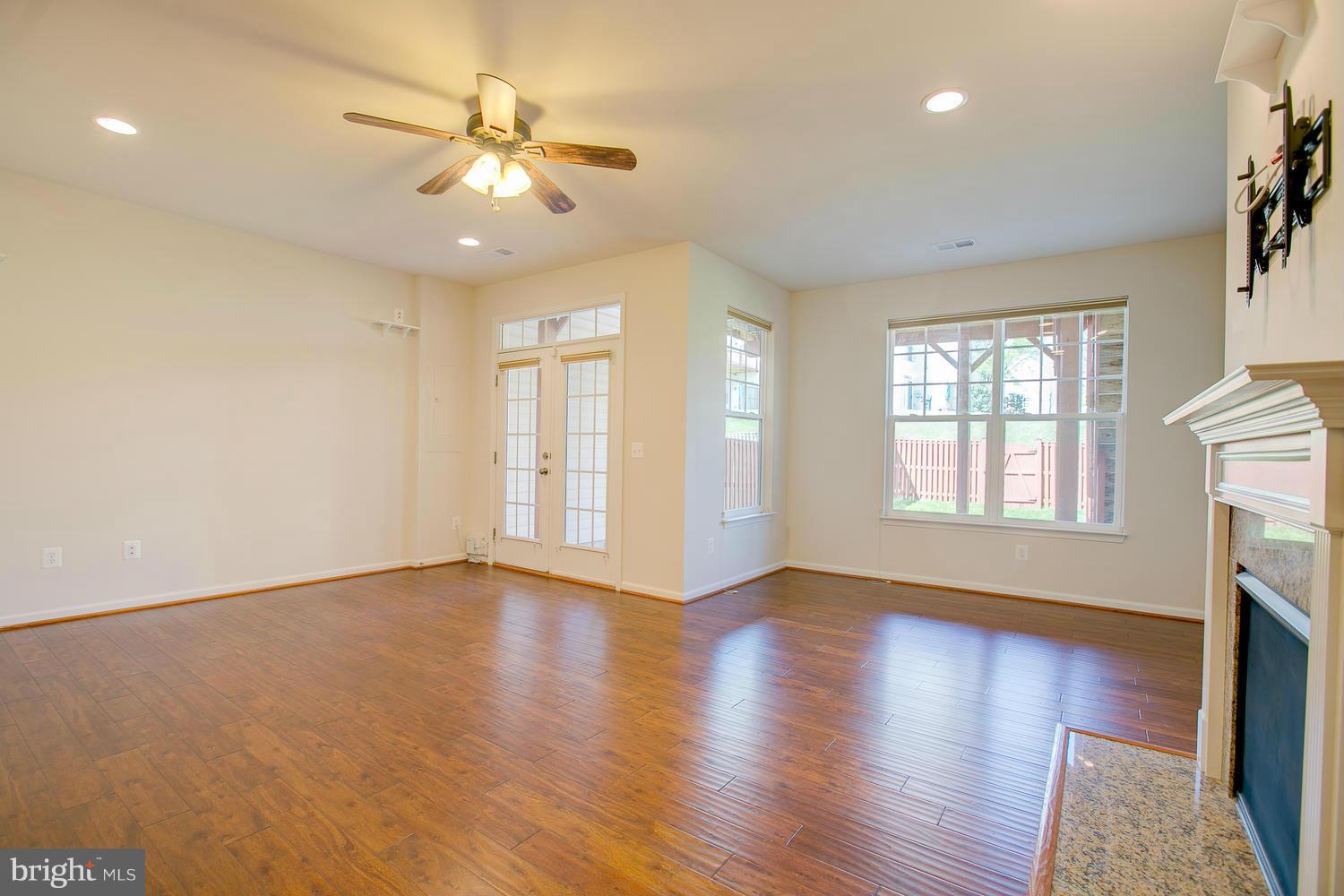 141 Short Branch Road Stafford, VA 22556 - Photo 22 of 30 a view of an empty room with wooden floor and a window