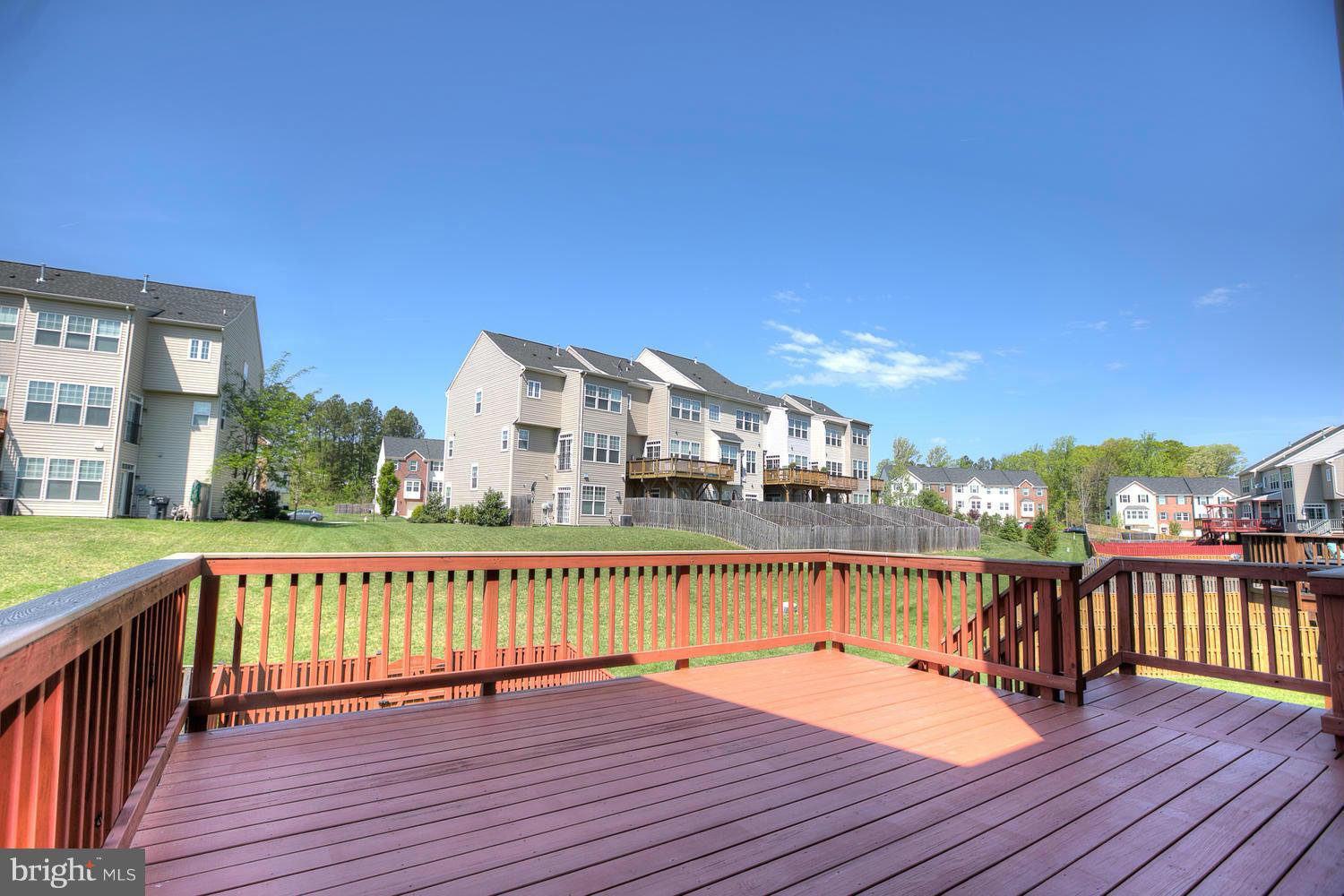 141 Short Branch Road Stafford, VA 22556 - Photo 27 of 30 a view of a balcony with wooden floor and city view