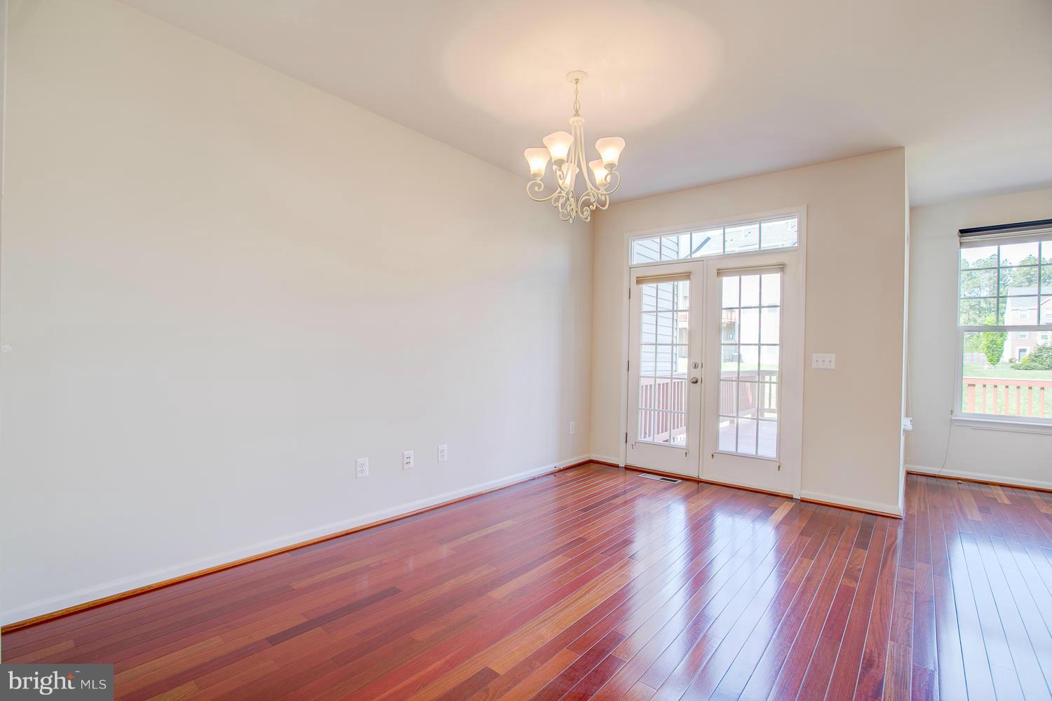 141 Short Branch Road Stafford, VA 22556 - Photo 6 of 30 an empty room with wooden floor and windows
