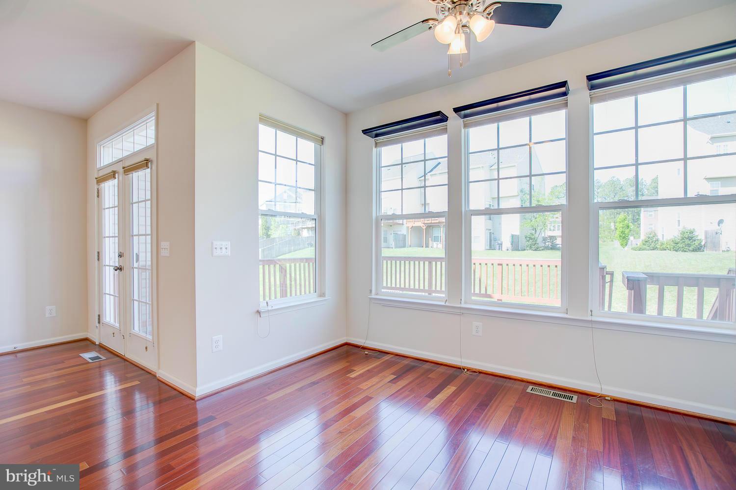 141 Short Branch Road Stafford, VA 22556 - Photo 9 of 30 an empty room with wooden floor and windows