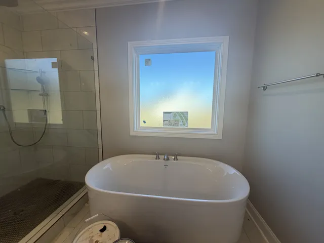 a white bath tub sitting in a bathroom