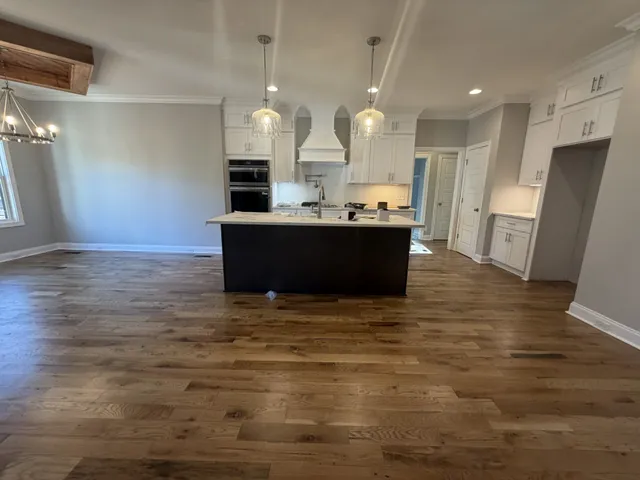 a view of kitchen and kitchen with furniture