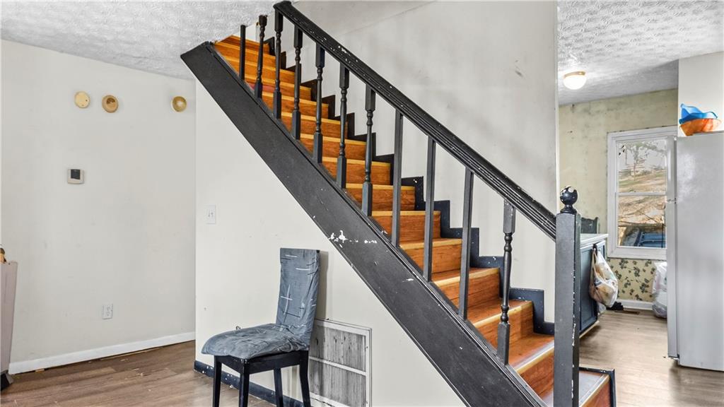 5 Ivy Street Canton, GA 30114 - Photo 13 of 27 a view of entryway with wooden floor and stairs