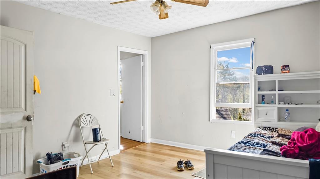 5 Ivy Street Canton, GA 30114 - Photo 20 of 27 a bedroom with a bed and the dresser