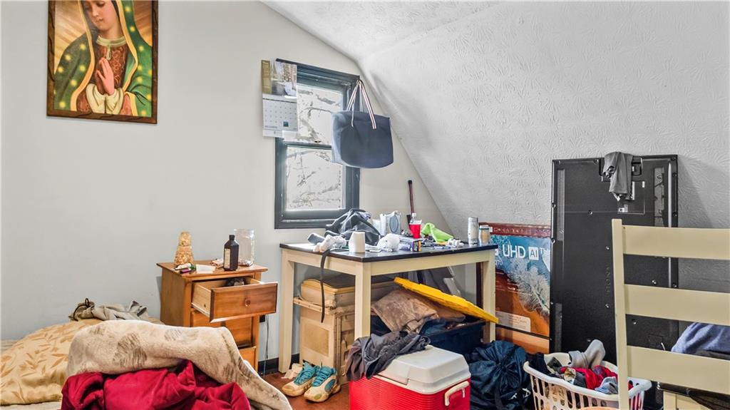 5 Ivy Street Canton, GA 30114 - Photo 24 of 27 a living room with furniture a rug and white walls