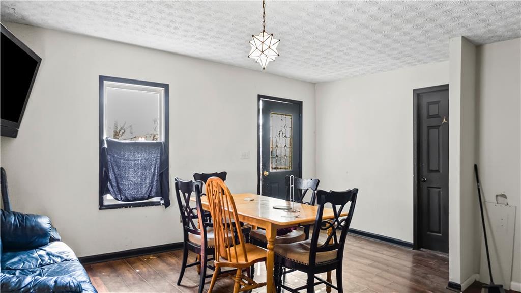 5 Ivy Street Canton, GA 30114 - Photo 10 of 27 a view of a dining room with furniture and wooden floor