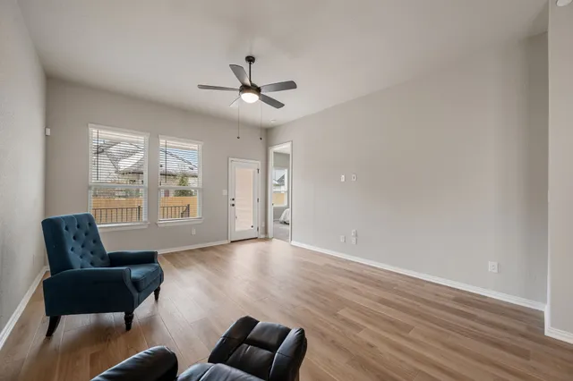 a living room with furniture and windows