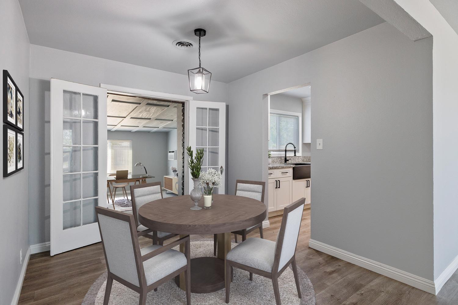 71 East Griffith Way Fresno, CA 93704 - Photo 12 of 35 a view of a dining room with furniture window and wooden floor