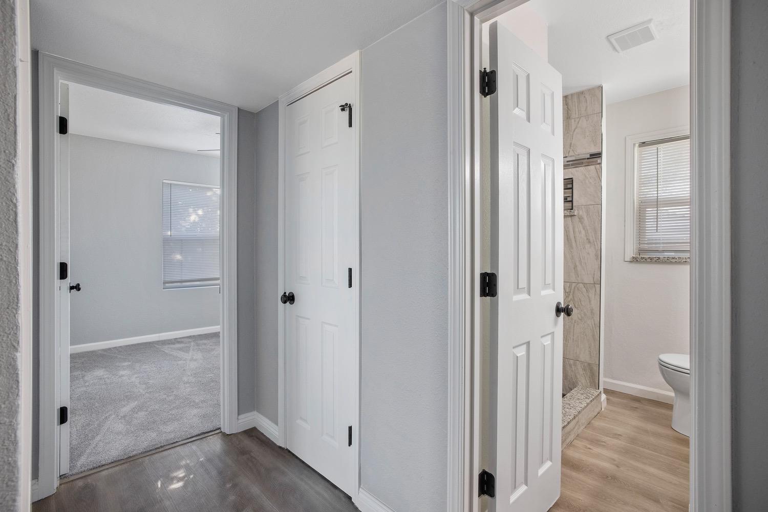 71 East Griffith Way Fresno, CA 93704 - Photo 18 of 35 a view of a bathroom from a hallway