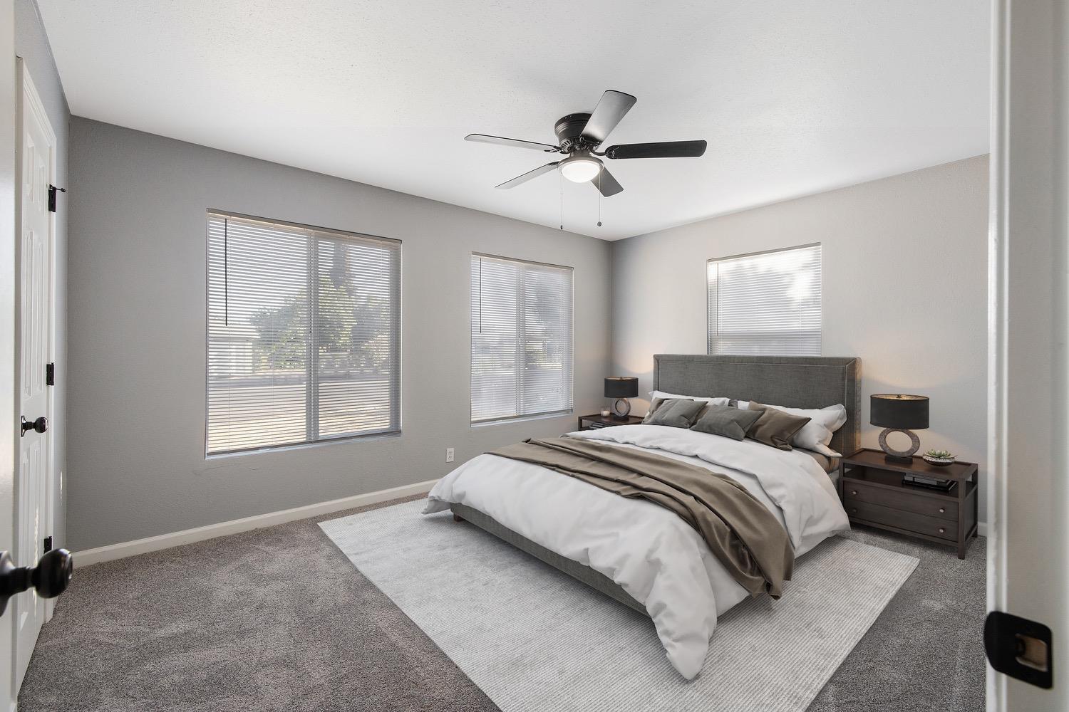 71 East Griffith Way Fresno, CA 93704 - Photo 19 of 35 a bedroom with a large bed and a window