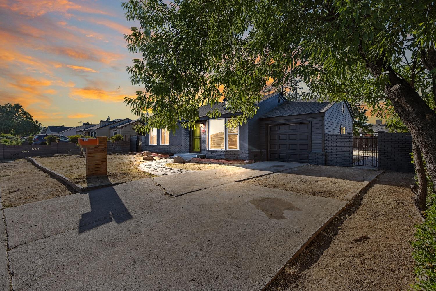 71 East Griffith Way Fresno, CA 93704 - Photo 2 of 35 a view of a house with a yard