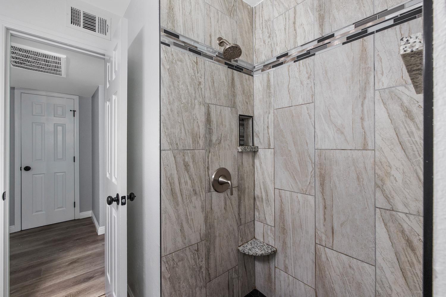 71 East Griffith Way Fresno, CA 93704 - Photo 24 of 35 a bathroom with a shower